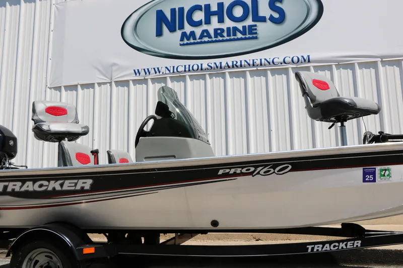 Slide: The Image of 2014 Bass Tracker Pro 16 boat at Nichols Marine dealership. - 16