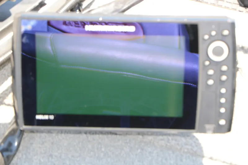 Slide: The Image of Fishfinder display on a 2014 Bass Tracker Pro 16 boat, showing sonar readings. - 21