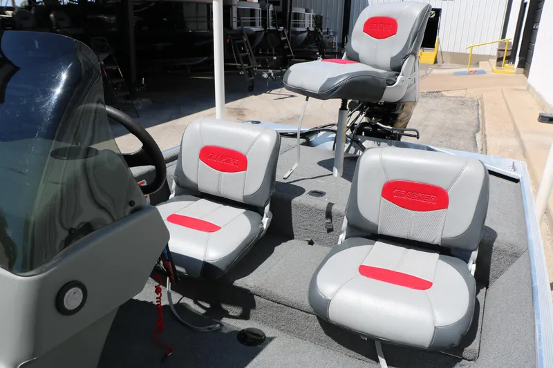 Slide: The Image of 2014 Bass Tracker Pro 16 boat interior with gray and red seating. - 25