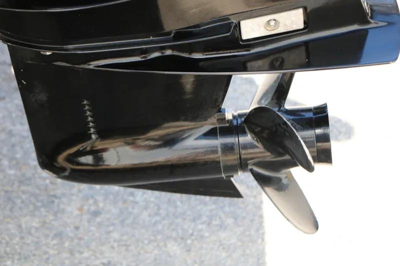 Slide: The Image of Close-up of a 2014 Bass Tracker Pro 16 boat propeller in black finish. - 32