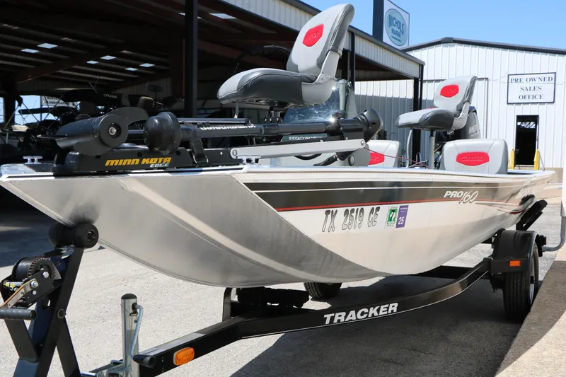 Slide: The Image of 2014 Bass Tracker Pro 16 boat on trailer, equipped with Minn Kota trolling motor. - 5
