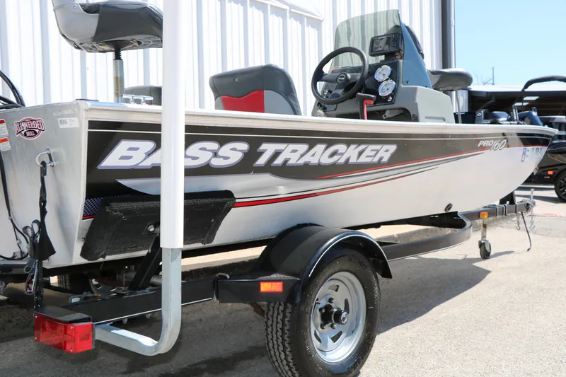 Slide: The Image of 2014 Bass Tracker Pro 16 boat on trailer, side view, outdoors. - 8