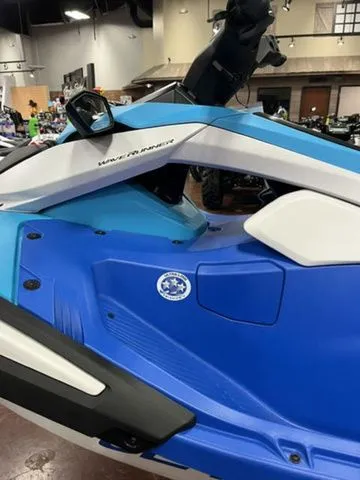 Slide: The Image of 2026 Yamaha WaveRunner JetBlaster in blue and white on showroom floor. - 13