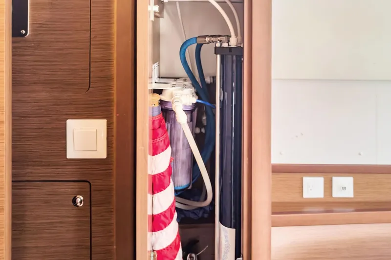 Slide: The Image of Interior view of a 2020 Lagoon 42 yacht showing a water filtration system. - 71