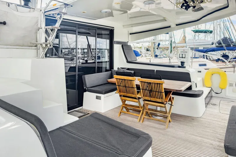 Slide: The Image of Spacious deck of 2020 Lagoon 42 catamaran with seating and dining area. - 8