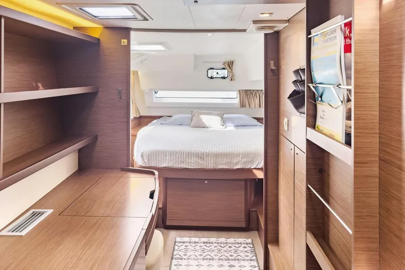 Slide: The Image of Luxurious interior of 2020 Lagoon 42 yacht with cozy bedroom and wooden furnishings. - 44