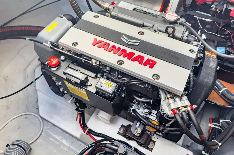 Slide: The Image of Yanmar engine in a 2020 Lagoon 42 catamaran, showcasing detailed components and connections. - 63