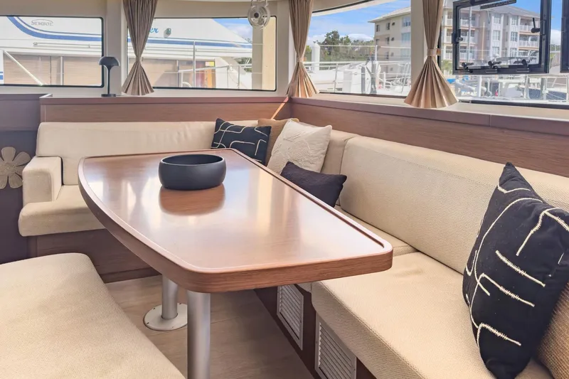 Slide: The Image of Interior of 2020 Lagoon 42 catamaran with elegant dining area and plush seating. - 40