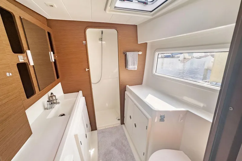 Slide: The Image of Modern bathroom interior of 2020 Lagoon 42 yacht with shower and window view. - 51