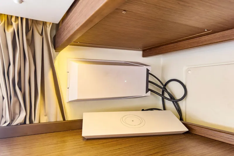 Slide: The Image of Modern interior of 2020 Lagoon 42 yacht with sleek electronic device and wooden accents. - 28
