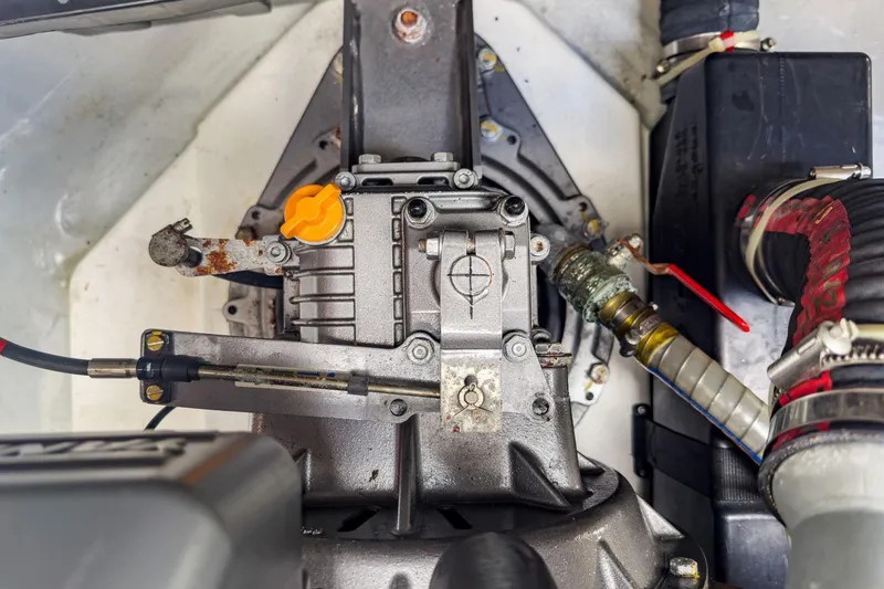Slide: The Image of Engine compartment of a 2020 Lagoon 42 catamaran, featuring mechanical components and hoses. - 67