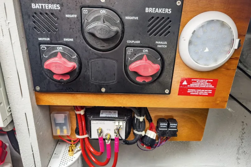 Slide: The Image of Battery and breaker panel on a 2020 Lagoon 42 yacht, featuring switches and wiring. - 68