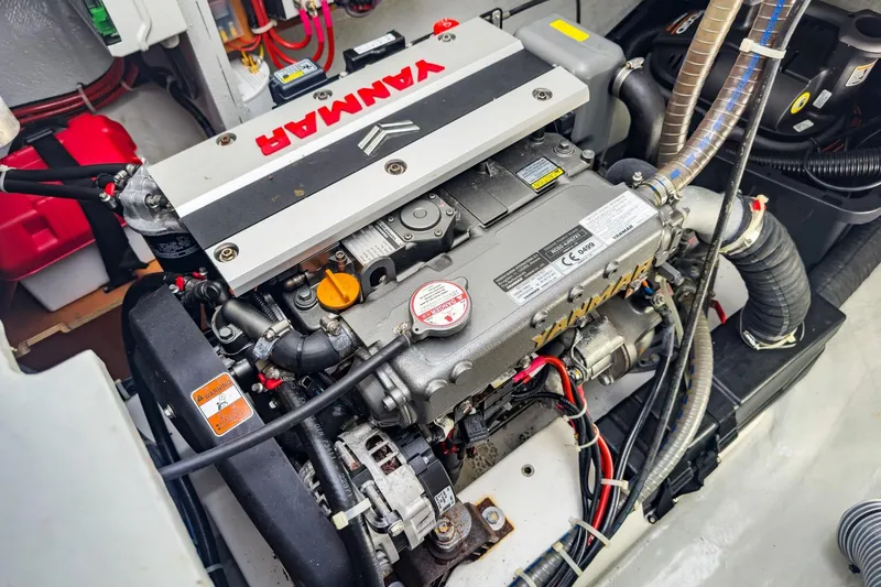 Slide: The Image of Engine compartment of a 2020 Lagoon 42 catamaran featuring a Yanmar engine. - 66