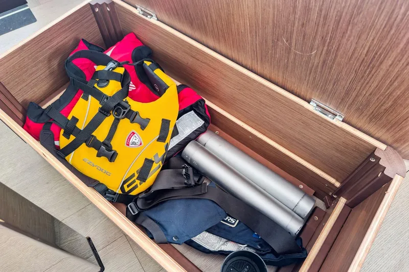 Slide: The Image of Storage compartment on a 2020 Lagoon 42 yacht with life jackets and equipment. - 76