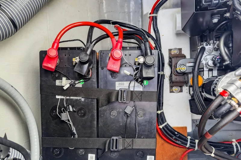 Slide: The Image of Battery compartment of a 2020 Lagoon 42 catamaran with cables and connectors. - 83