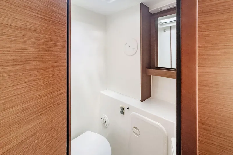 Slide: The Image of Interior of 2020 Lagoon 42 yacht bathroom with wooden accents and modern fixtures. - 59
