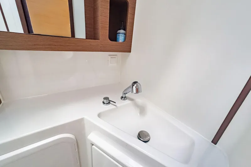 Slide: The Image of Modern bathroom sink in 2020 Lagoon 42 yacht, featuring sleek design and wooden accents. - 60
