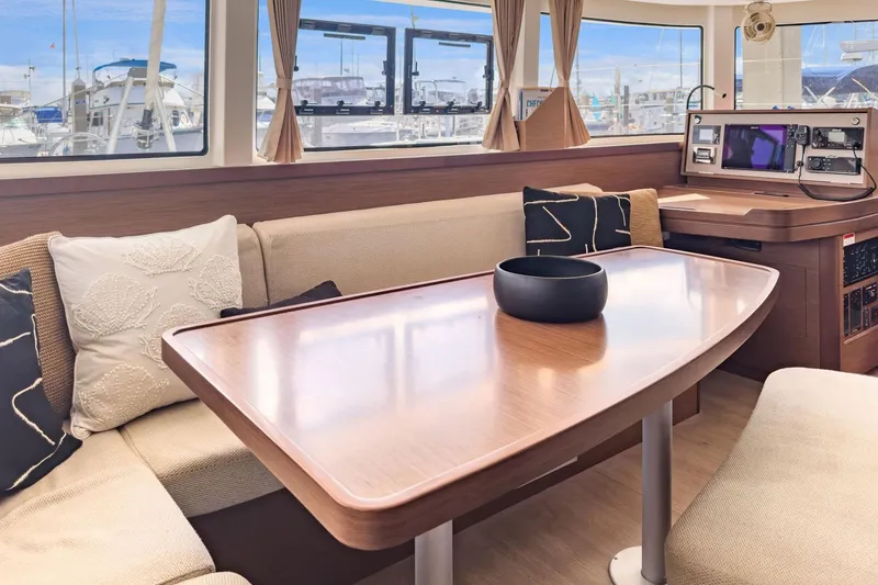 Slide: The Image of Interior of 2020 Lagoon 42 catamaran with elegant seating and navigation station. - 38