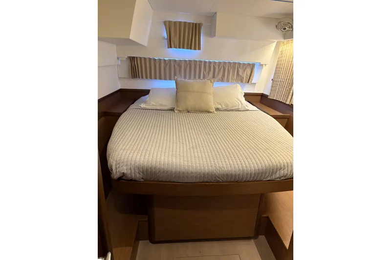 Slide: The Image of Cozy bedroom interior of 2020 Lagoon 42 yacht with comfortable bedding. - 100