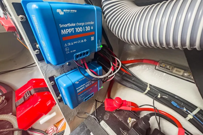 Slide: The Image of Victron Energy SmartSolar charge controllers in Lagoon 42, 2020 model, with wiring and components. - 88