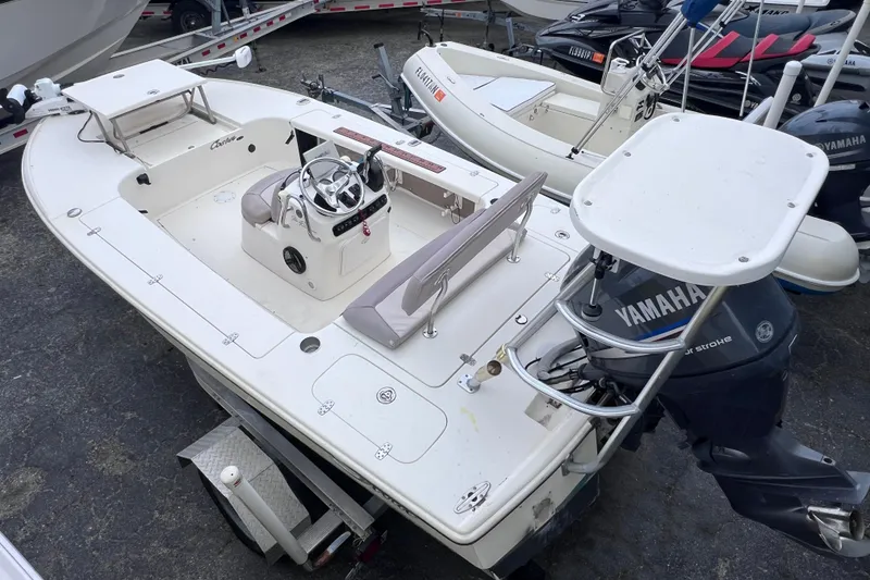 The Image of 2007 Scout 170 Costa boat with Yamaha motor, parked on a trailer. - 0