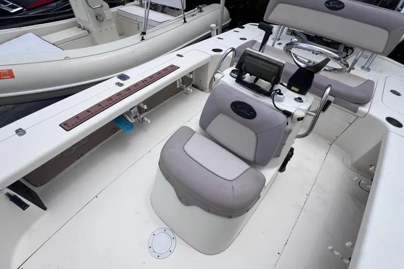Slide: The Image of 2007 Scout 170 Costa boat interior with steering console and seating. - 11