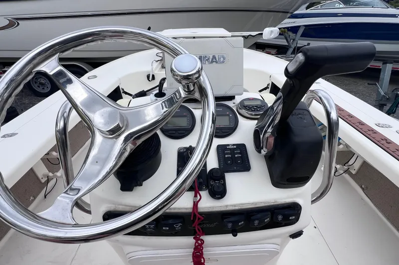 Slide: The Image of Steering console of a 2007 Scout 170 Costa boat with controls and gauges. - 14