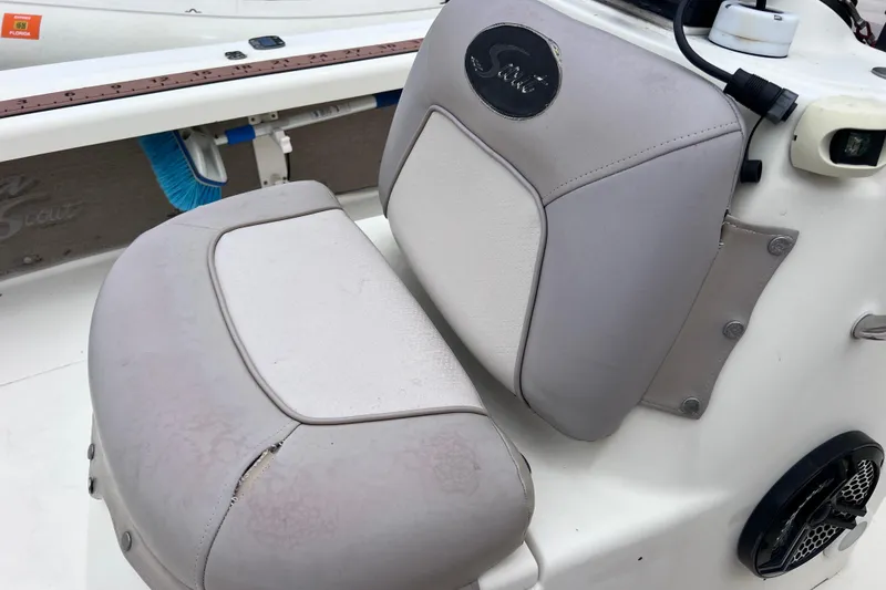 Slide: The Image of 2007 Scout 170 Costa boat seat with visible wear and tear. - 16
