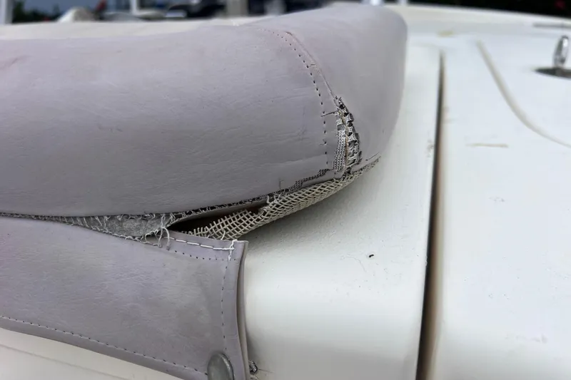 Slide: The Image of Close-up of worn seat upholstery on a 2007 Scout 170 Costa boat. - 17