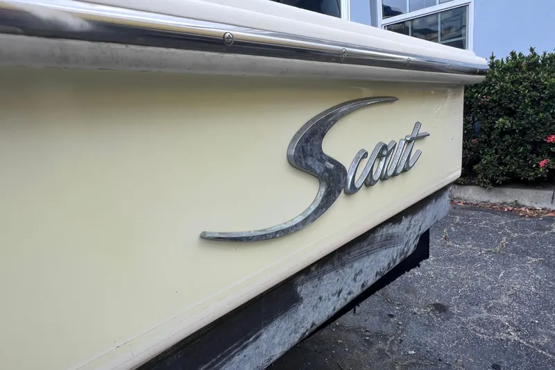 Slide: The Image of 2007 Scout 170 Costa boat with logo, parked outdoors. - 6