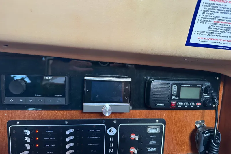 Slide: The Image of Control panel of a 2002 Hunter 306 sailboat with radio and navigation equipment. - 29