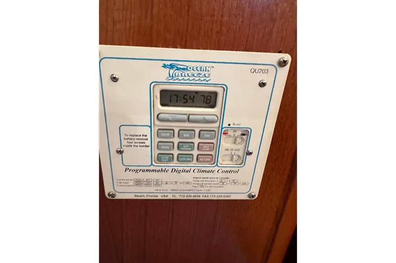 Slide: The Image of Programmable digital climate control panel on 2002 Hunter 306 boat interior. - 30