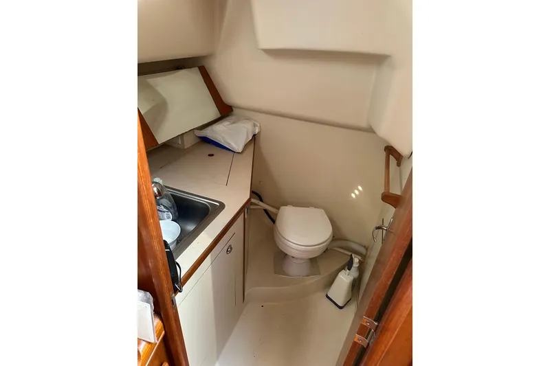 Slide: The Image of Compact bathroom in 2002 Hunter 306 sailboat with sink and toilet. - 33