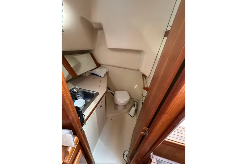 Slide: The Image of Compact bathroom in 2002 Hunter 306 sailboat with sink and toilet. - 34