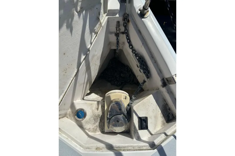 Slide: The Image of Anchor chain compartment on a 2002 Hunter 306 sailboat deck. - 8