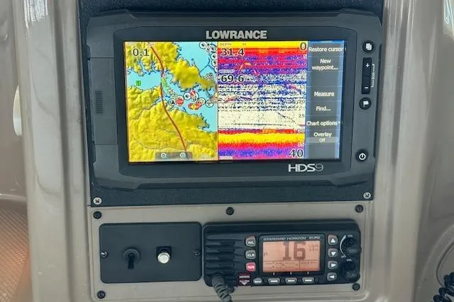 Slide: The Image of Lowrance HDS marine GPS and radio on 2001 Maxum 3000 SCR boat dashboard. - 13