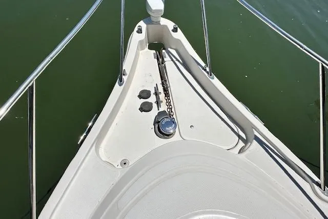 Slide: The Image of Bow of 2001 Maxum 3000 SCR boat with anchor chain and railing. - 16
