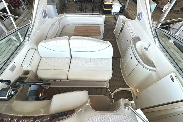Slide: The Image of 2001 Maxum 3000 SCR boat interior with white seating and wooden accents. - 18