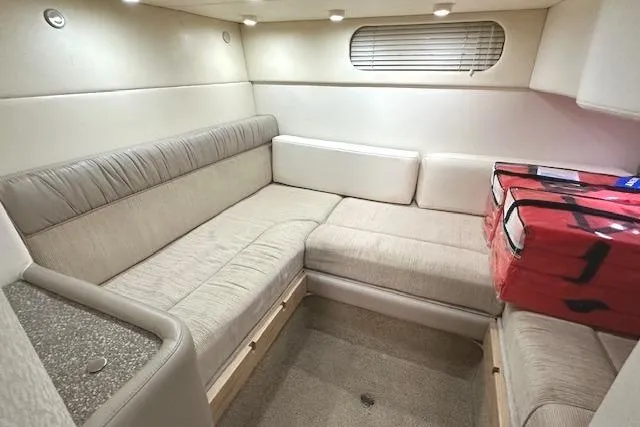 Slide: The Image of Interior of 2001 Maxum 3000 SCR boat with beige seating and modern design. - 25