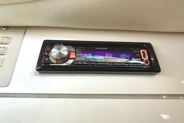 Slide: The Image of Kenwood stereo system in a 2001 Maxum 3000 SCR boat dashboard. - 28