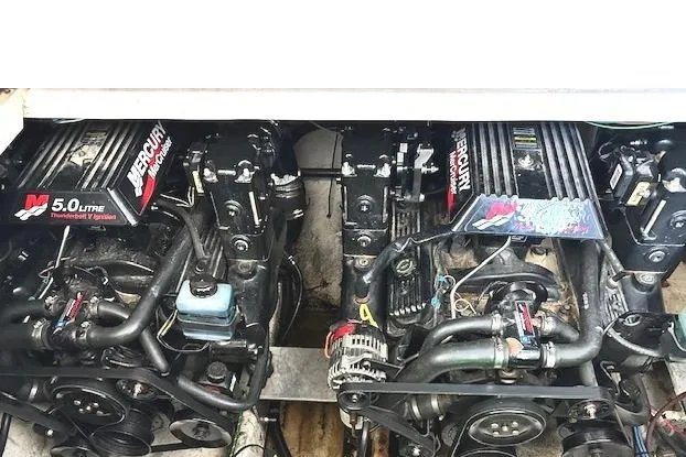Slide: The Image of Twin Mercury 5.0L engines in a 2001 Maxum 3000 SCR boat. - 32
