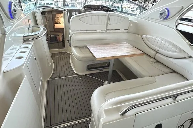 Slide: The Image of Interior of 2001 Maxum 3000 SCR boat with seating and table arrangement. - 8
