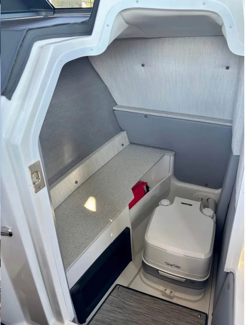 Slide: The Image of Interior of 2024 Cobalt R6SURF featuring portable toilet. - 13