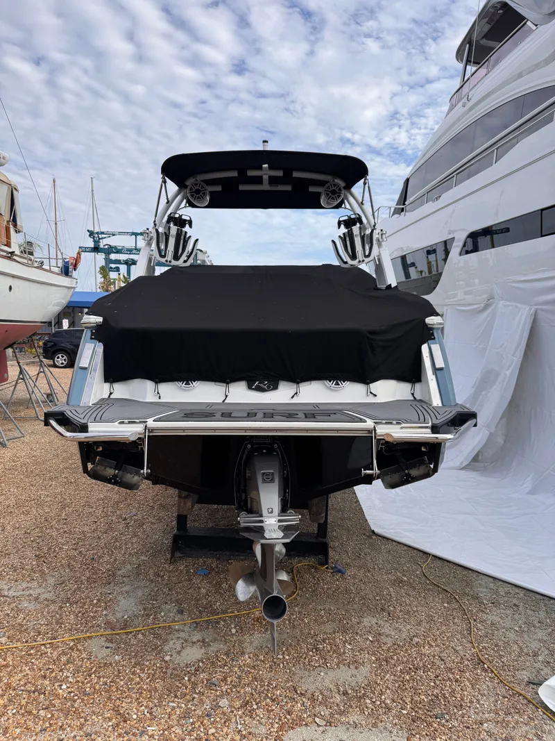 Slide: The Image of 2024 Cobalt R6SURF boat, rear view at the dock. - 5