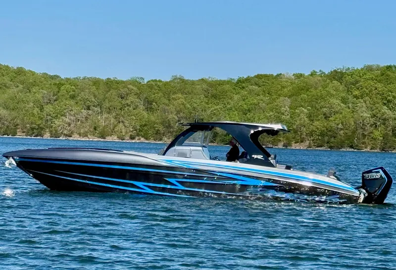 The Image of Renegade 42R boat on lake, available at RK Motorsports. - 0