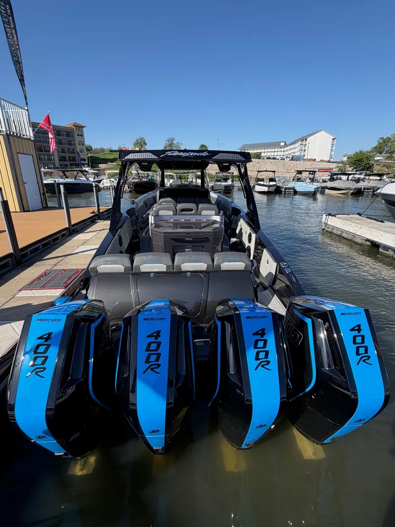 Slide: The Image of Renegade 42R 2027 boat with four outboard engines at dock. - 13