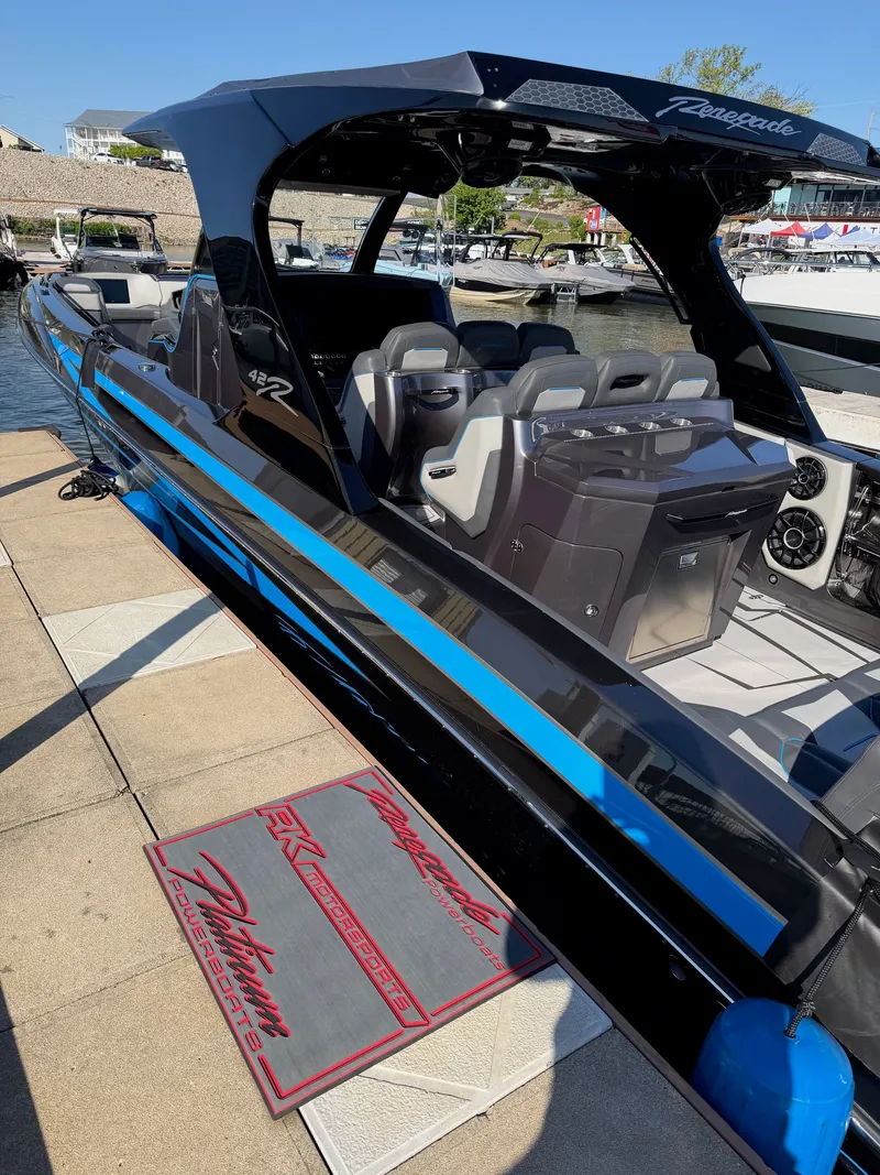 Slide: The Image of Renegade 42R 2027 boat with blue LED lighting in a dark setting. - 4