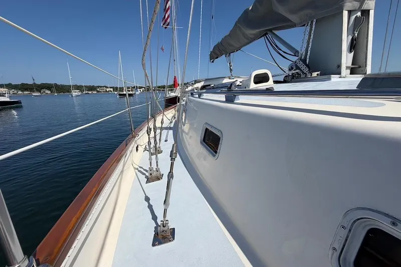 Slide: The Image of Sailboat deck view, Bruce Roberts 35, 1990 model, docked in a serene marina. - 46