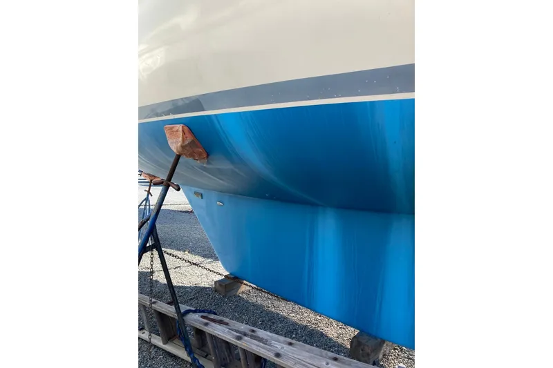 Slide: The Image of Bruce Roberts 35 sailboat hull, 1990 model, displayed on a stand. - 59
