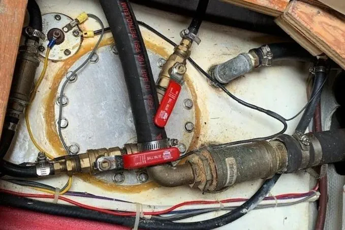 Slide: The Image of Diesel engine tank showing hoses and fittings. - 32